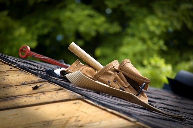 Picture of roofing Reno employee tool belt on a roof